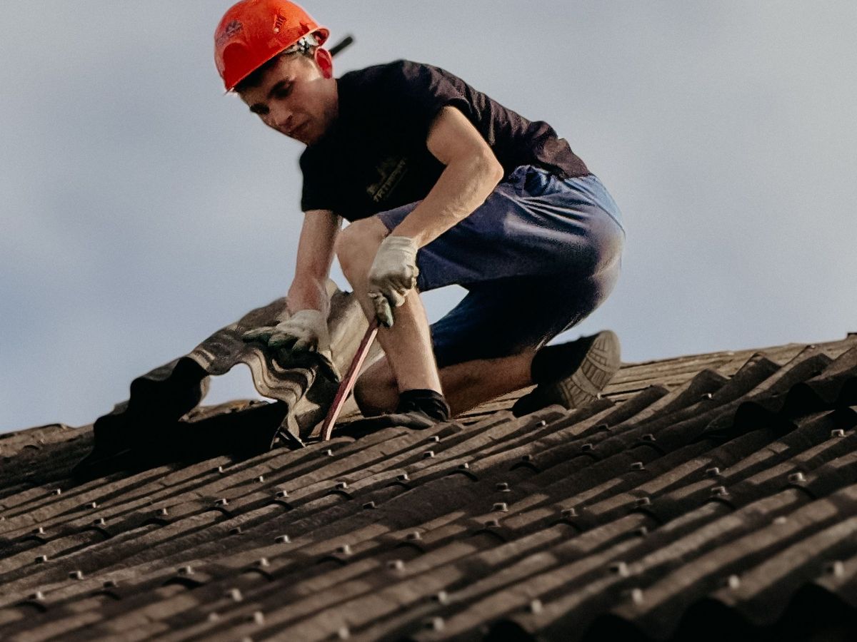 Replace cracked roof tiles and repair flashing